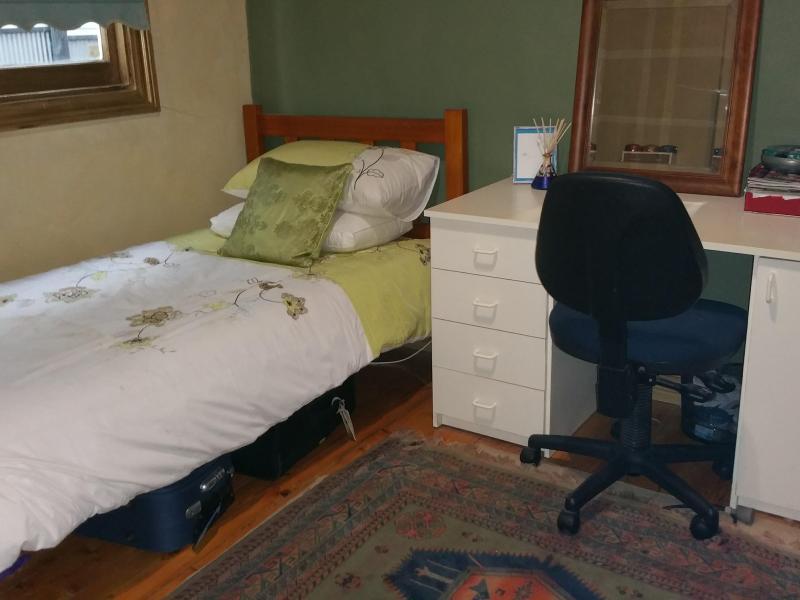 Bed and desk in student room